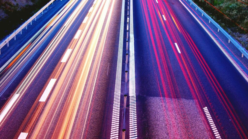 close up of highway road with red lights